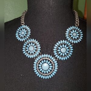 Turquoise-colored flower-motif statement necklace
